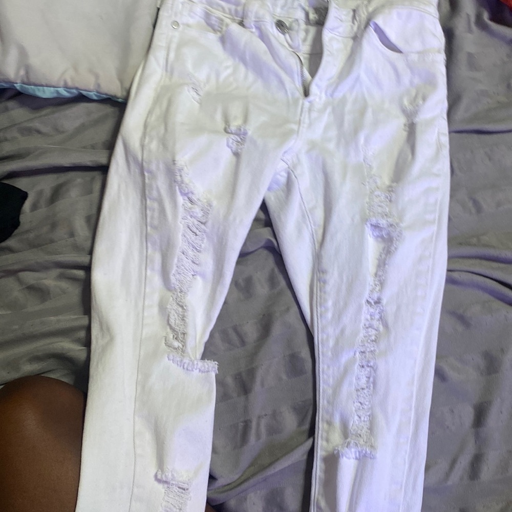 White pants with rips